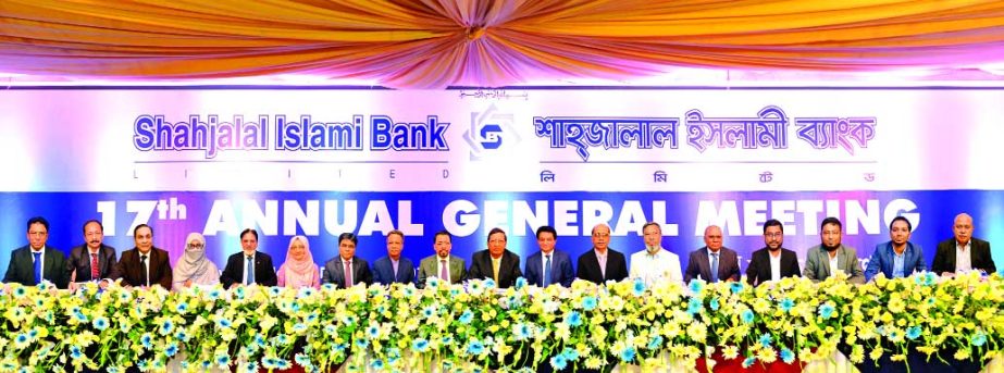 Akkas Uddin Mollah, Chairman of the Board of Directors of Shahjalal Islami Bank Limited, presiding over its 17th AGM at a convention centre in the city on Sunday. The AGM approved 10 percent stock dividend for the shareholders for the year 2017. Farman R