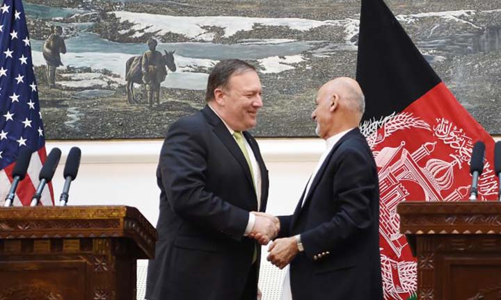 US Secretary of State Mike Pompeo (L) shakes hands with Afghan President Ashraf Ghani (R) after a press conference at the Presidential Palace in Kabul on Monday.