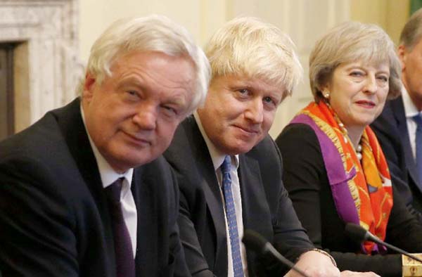 David Davis, left, quit as Brexit minister on Sunday, then Boris Johnson, centre, resigned on Monday. British PM Theresa May, right, quickly replaced them