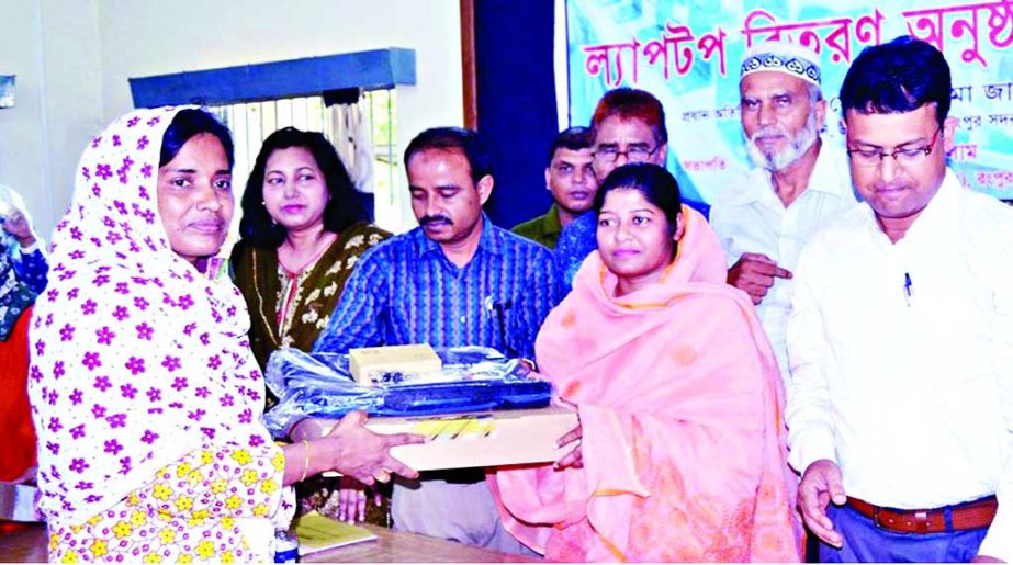 RANGPUR: Nasima Zaman Boby, Chairman, Sadar Upazila and General Secretary of District Unit of Jubo Mahila Awami League distributing laptops among the Headmaster of government primary schools at a function as Chief Guest on Tuesday.