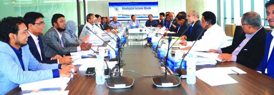 Akkas Uddin Mollah, Chairman of the Board of Directors of Shahjalal Islami Bank Limited, presiding over its 265th meeting at its head office on Wednesday. Farman R Chowdhury, Managing Director, Dr Anwar Hossain Khan, Md Sanaullah Shahid, Shamsuddin Khan,