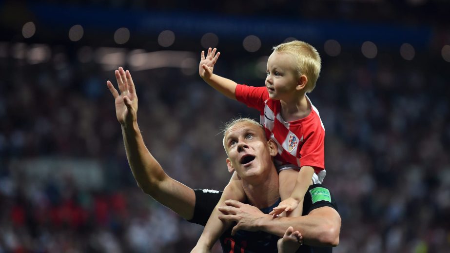 Domagoj Vida of Croatia celebrates with his son following his sides victory in the 2018 FIFA World Cup Russia semi-final match between Croatia and England at the Luzhniki Stadium in Moscow, Russia on Wednesday night.