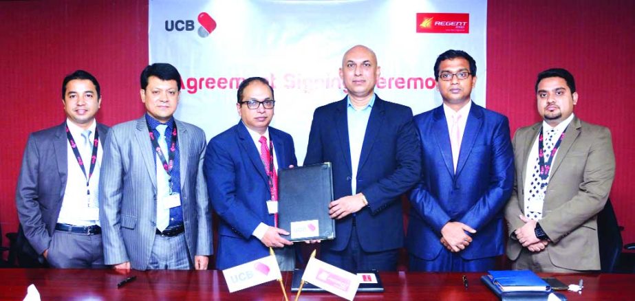 Nehal A Huda, Head of Cards of United Commercial Bank Limited and Sohail Majid, Director (Sales & Marketing) of Regent Airways, exchanging an agreement signing documents at the bank head office in the city on Thursday. Under the deal, all Credit and Debit