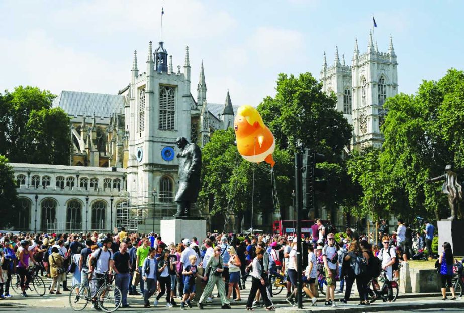 A giant balloon depicting President Trump as an angry orange baby taking off in Parliament Square in London on Friday.