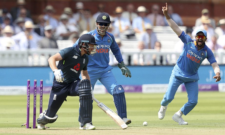 India's MS Dhoni (centre) celebrates as England's Jonny Bairstow is bowled out by India's Kuldeep Yadav (not pictured) during the second one day international cricket match between England and India at Lord's, London on Saturday.