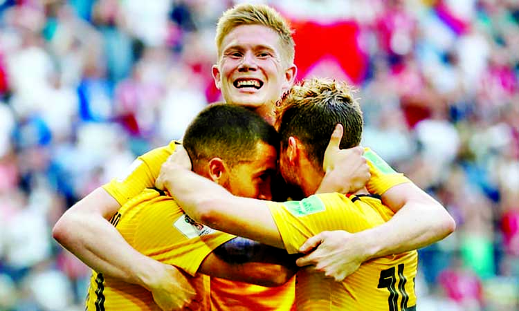 Belgium's Eden Hazard, left, celebrates scoring their second goal with Kevin De Bruyne, centre, and Dries Mertens.