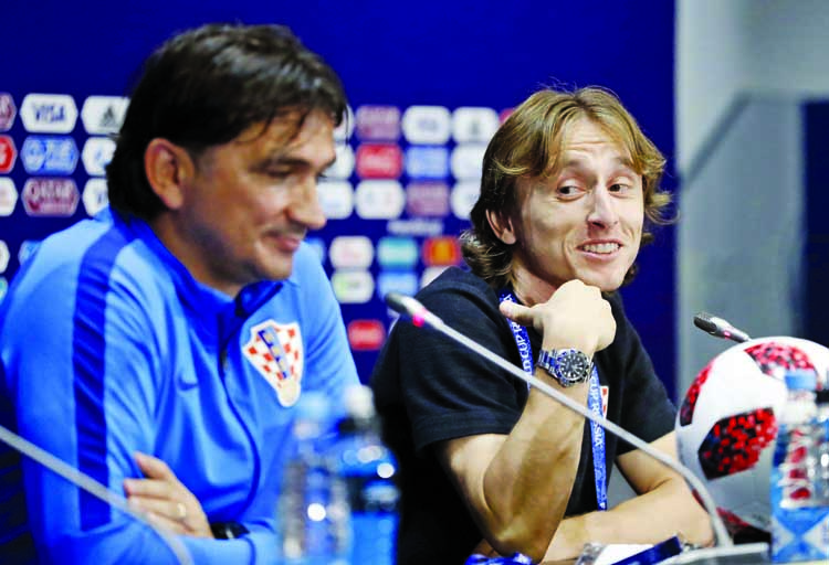 Croatia's Luka Modric (right) points at Croatia head coach Zlatko Dalic during a news conference of the Croatian national team at the 2018 soccer World Cup in Moscow on Saturday.