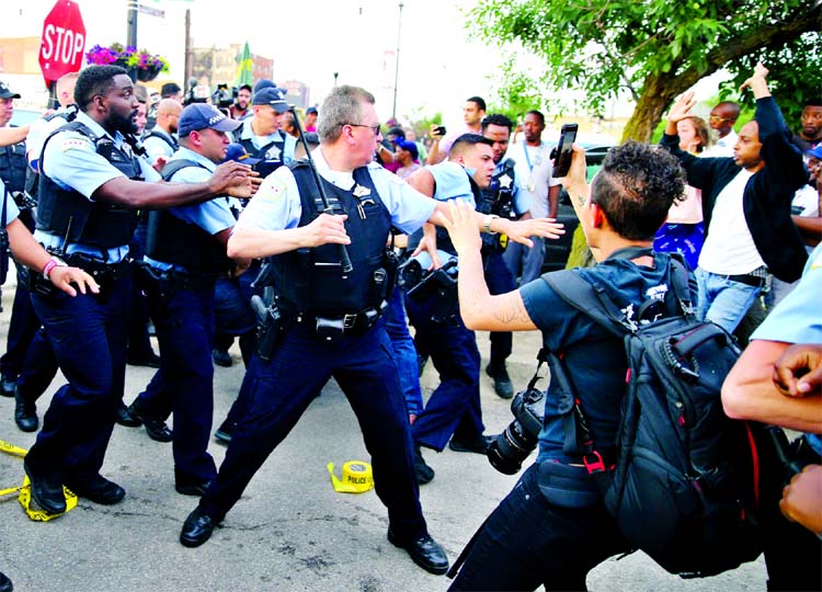 Protesters demand answers after violent confrontations between police and demonstrators lead to four arrests.