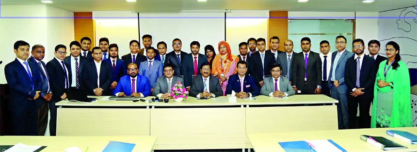 Md. Mehmood Husain, Managing Director of NRB Bank Limited poses with the participants of the 1st Foundation Training Course of the bank inaugurated at its training center on Sunday. Imran Ahmed FCA, Chief Operating Officer, Rahat Shams, Head of Retail Ban