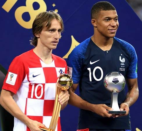 Luka Modric (left) poses with the Golden Ball with Kylian Mbappe holding his Young Player Award on Sunday.