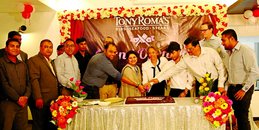 US Ambassador to Bangladesh Marcia Bloom Bernicat, centre, joins others in cutting a cake at the grand opening ceremony of US-Based Steak and ribs chain restaurant Tony Roma's first Bangladesh branch in Cityâ€™s Gulshan-2 on Monday.