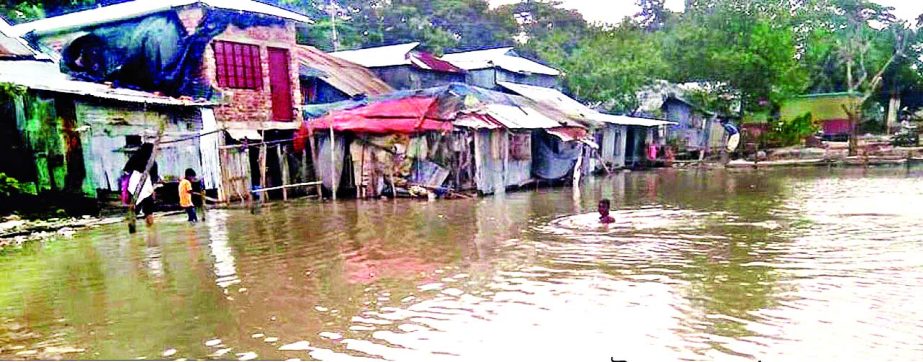 PATUAKHALI: Anderkilla River side areas have been submerged at Kalapara Upazila by flood water . This snap was taken yesterday.