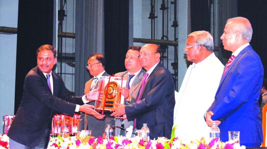 Parvez Rahman, Managing Director, BRB Cable Industries Limited, receiving the National Export Trophy (Gold) for the Year 2014-2015 from Commerce Minister Tofail Ahmed in recognition of its tremendous achievement in Export Business of Electrical and Electr