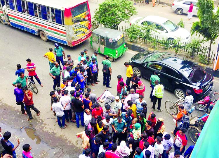 A car driver of a Birdem Hospital doctor was killed on the spot when a bus ran over him in city's Shahbagh intersection on Wednesday.