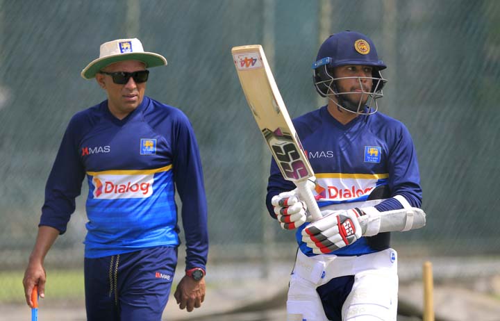 Sri Lanka's batsman Kusal Mendis (right) and coach Chandika Hathurusingha attend a training session ahead of their second Test cricket match against South Africa in Colombo, Sri Lanka on Thursday. The second Test begins today.