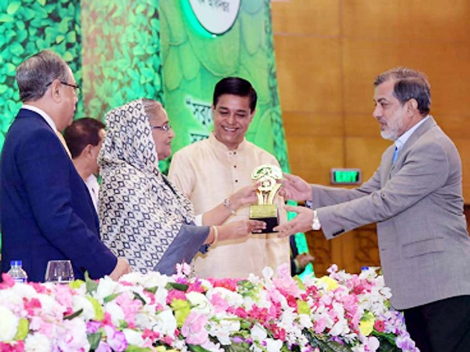 Chairman of the Parliamentary Standing Committee on Ministry of Railway and local legislature of Raozan Constituency ABM Fazle Karim Chowdhury MP(first from right) seen receiving Golden Award from Prime Minister Sheikh Hasina at Bangabandhu Internationa