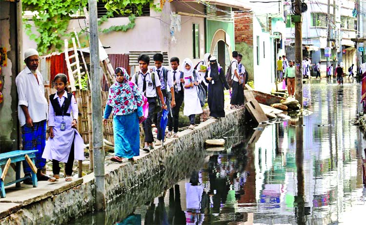 Vast areas of Matuail remain under water for several months forcing the locals to pass through the space mean for constructing foothpath.