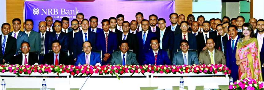Md. Mehmood Husain, Managing Director of NRB Bank Limited, poses with the participants of its Half-yearly Business Review Meeting-2018 in the city on Saturday. Saaduddin Ahmed, Deputy Managing Director and CRO, Imran Ahmed FCA, Chief Operating Officer, Md