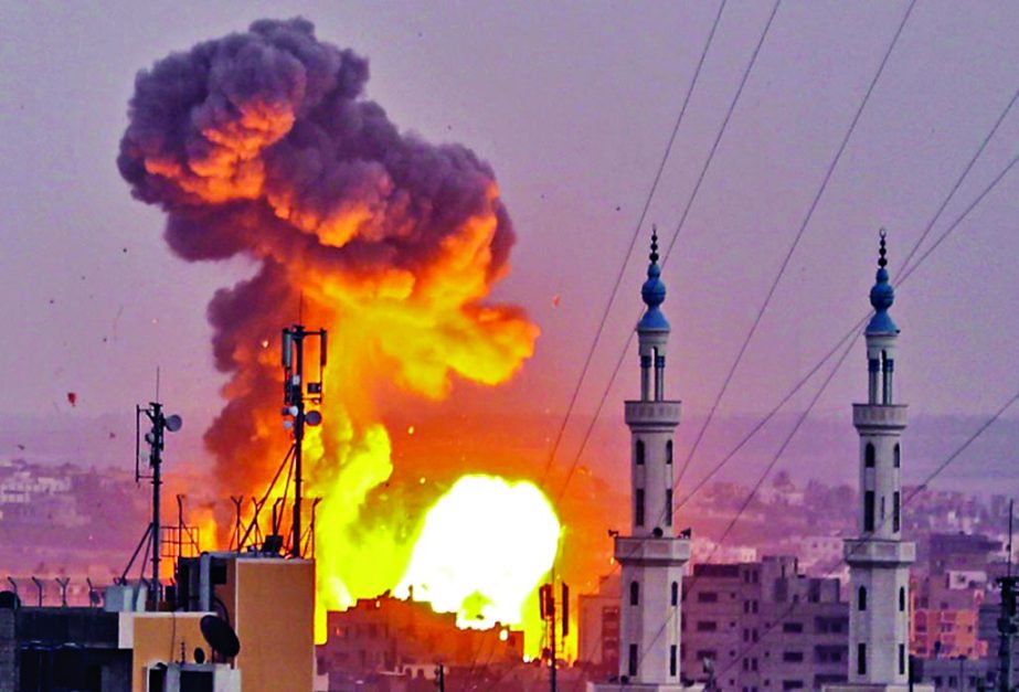 A picture shows a fireball exploding in Gaza City during Israeli bombardment.