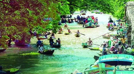 JHALAKATHI: Traders passing busy time at Bimruli Floating Haat in Jhalakathi which is famous for guava . This snap was taken on Sunday.