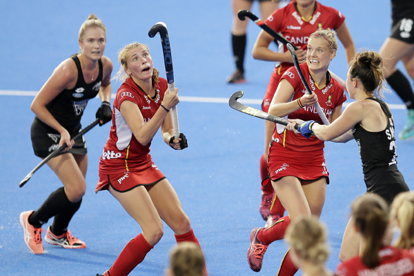 Belgium's Stephanie Vanden Borre (second left) controls the ball as New Zealand's Samantha Harrison (left) Belgium's Anne-Sophie Weyns (second right) and New Zealand's Kelsey Smith (right) look on during the group stage match between New Zealand and B