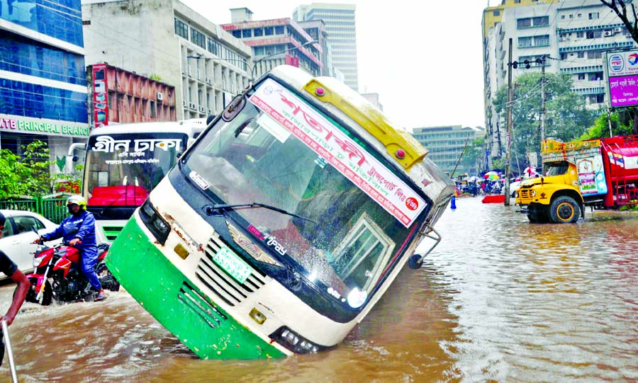 Due to absence of adequate drainage system, streets of city's Motijheel area were flooded with rain water causing road accident. This picture was taken on Monday.