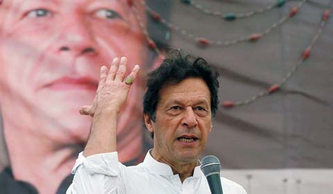 Imran Khan, chairman of the Pakistan Tehreek-e-Insaf (PTI), gestures while addressing his supporters during a campaign meeting ahead of general elections in Karachi.