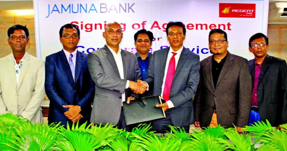 A K M Saifuddin Ahamed, DMD of Jamuna Bank Limited and Sohail Majid, Director (Marketing & Sales) of REGENT airways, exchanging an agreement at the Bank's head office in the city recently. Under the deal, employees and Credit Card holders of the Bank wil