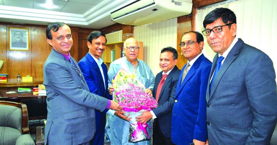 A delegation of Institute of Cost and Management Accountants of Bangladesh led by its President Mohammed Salim FCMA, presenting a bouquet of flowers to Finance Minister Abul Maal Abdul Muhith at the latter's office on Wednesday. Among others, Past Presid