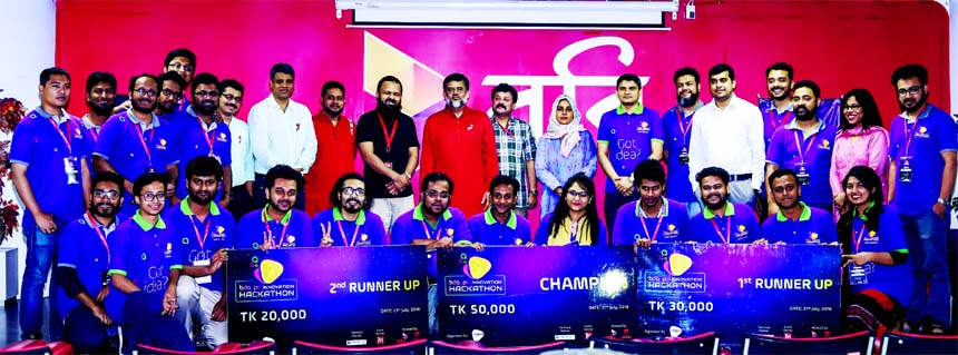 Shihab Ahmad, Chief Digital Services Officer of Robi, poses for a photograph with the champion team of BDApps Innovation Hackathon (the biggest mobile application platform of the country) at Robi Corporate Office in the city on Friday. Md. Showkat Kader C