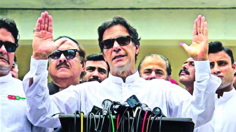 Imran Khan, chairman of Pakistan Tehreek-e-Insaf (PTI), speaks to members of media after casting his vote at a polling station during the general election in Islamabad, Pakistan.