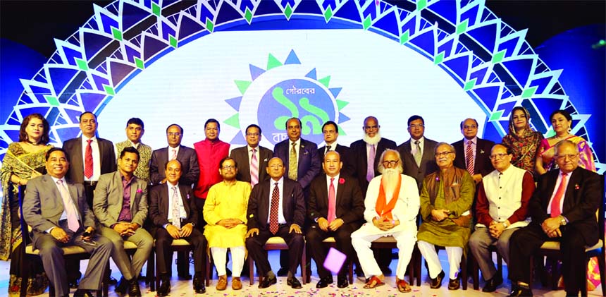 Commerce Minister Tofail Ahmed, Cultural Minister Asaduzzaman Noor, Chairman of Mercantile Bank Limited A.K.M. Shaheed Reza, Managing Director of the Bank Kazi Masihur Rahman are seen posing with award winners at 'Mercantile Bank Sommanona- 2018' on Sat