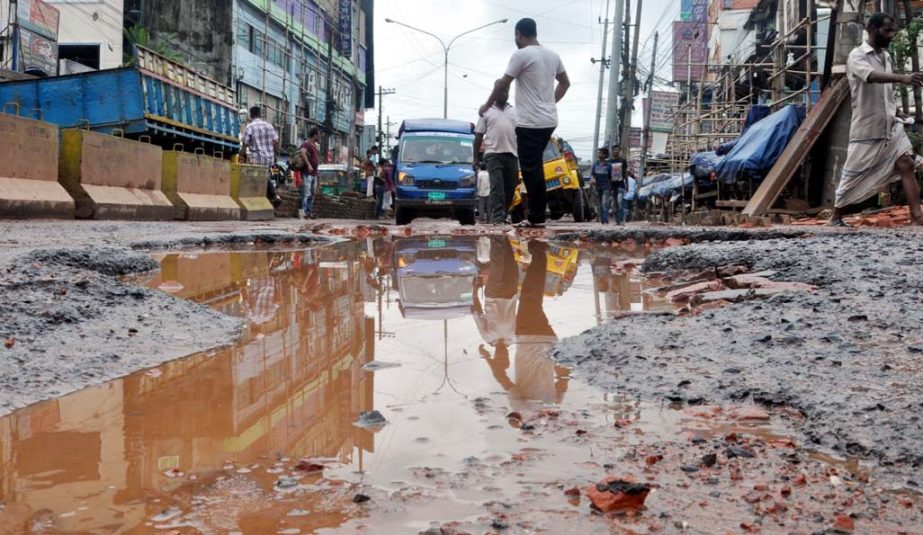 Big pothole were found on DND Road at Dhaka- Chattogram Highway. This picture was taken from Alonkar Point yesterday.