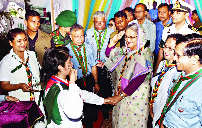 Prime Minister Sheikh Hasina distributing Shapla Cub Awards and inaugurating and laying foundation of seven projects of Bangladesh Scouts and Girl Guides Association at Ganabhaban yesterday afternoon. Photo : BSS