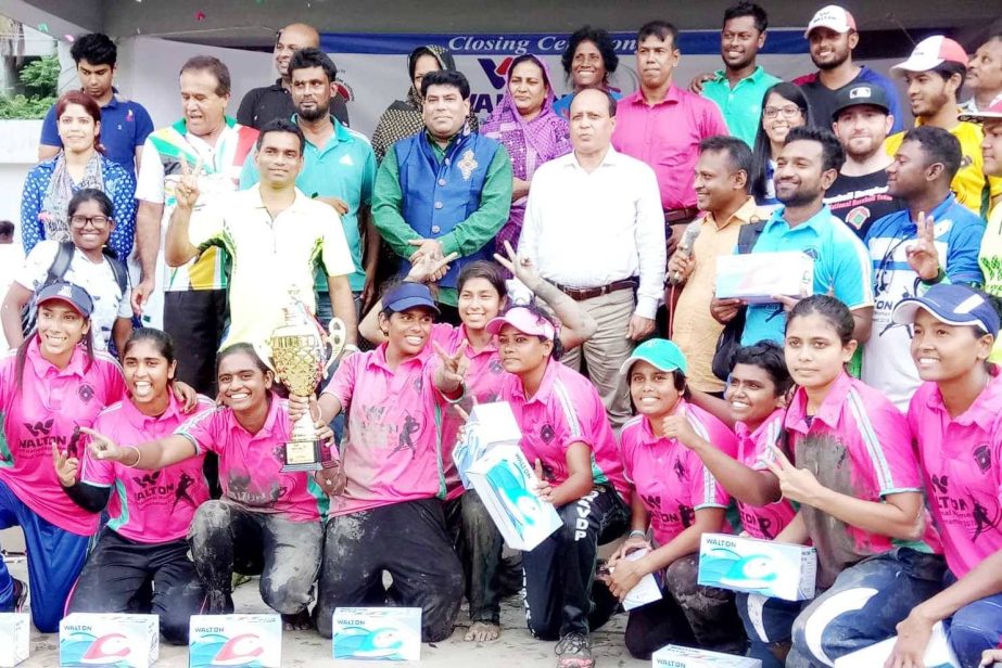 Members of Bangladesh Ansar, the champions of the Walton 2nd National Women's Baseball Competition with the guests and officials of Bangladesh Baseball-Softball Association pose for a photo session at the Sultana Kamal Women's Sports Complex in the city