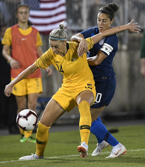 United States' Carli Lloyd (right) pressures Australia's Alanna Kennedy during a women's international soccer match in East Hartford, Conn. on Sunday.