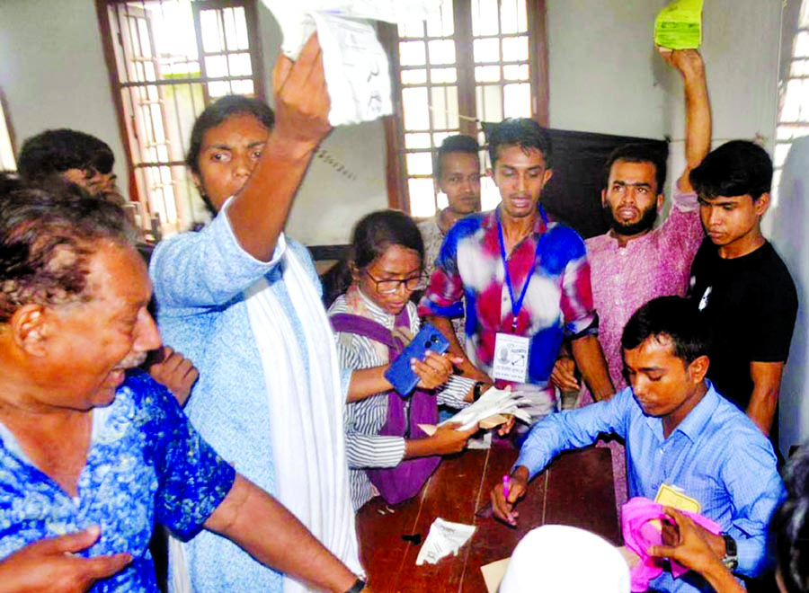 Bangladesh Samajtantrik Dal (BSD) Mayoral candidate for Barishal City Corporation showing the ballot papers already stamped in favour of Awami League Mayoral candidate (boat symbol) on Monday.
