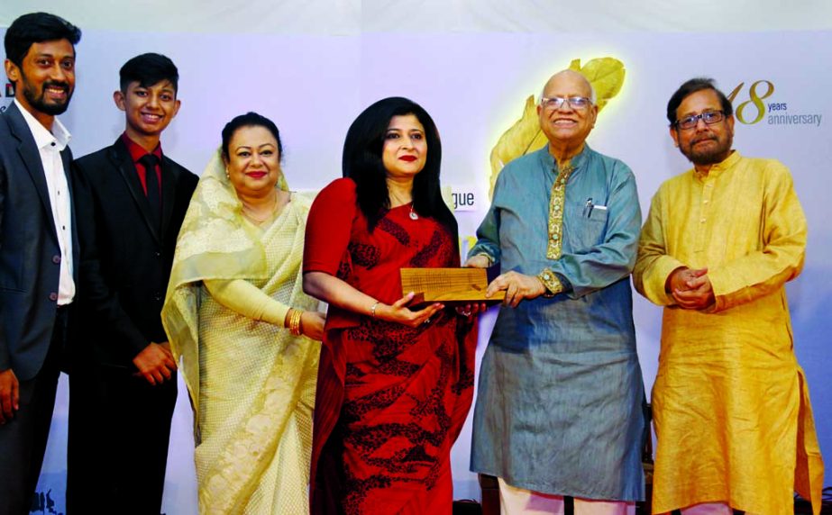 Farzana Chowdhury, CEO of Green Delta Insurance, receiving the Golden Pen Business Award from Finance Minister Abul Maal Abdul Muhith at a city convention center recently. Cultural Affairs Minister Asaduzzaman Noor was also present. The programme was orga