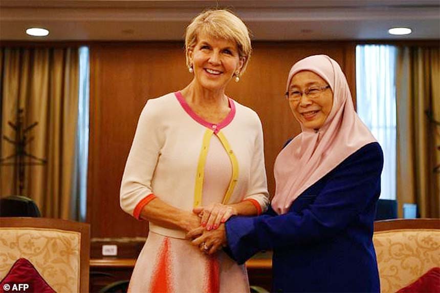 Malaysian Deputy Prime Minister Wan Azizah Wan Ismail (right) shakes hands with Australian Foreign Minister Julie Bishop.