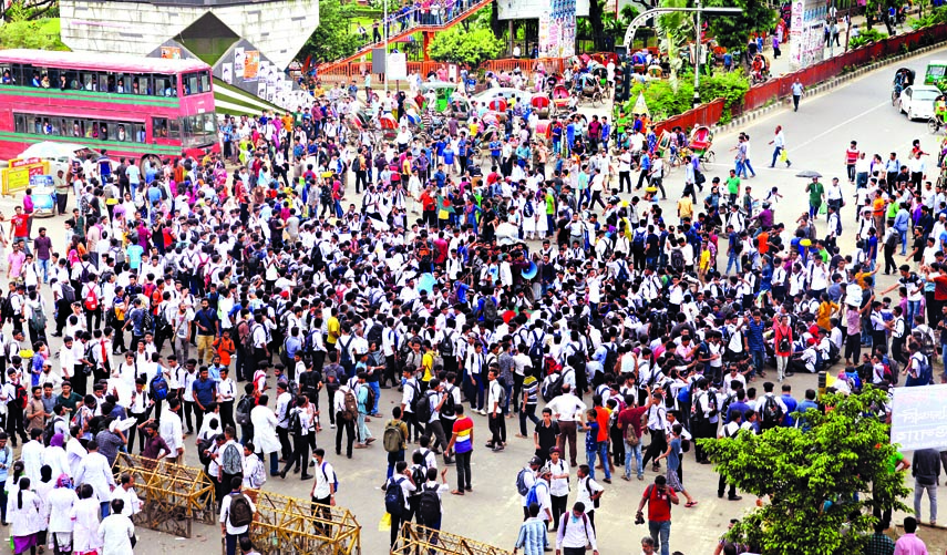 Agitated students bloked the road at Kakrail intersection on Wednesday.