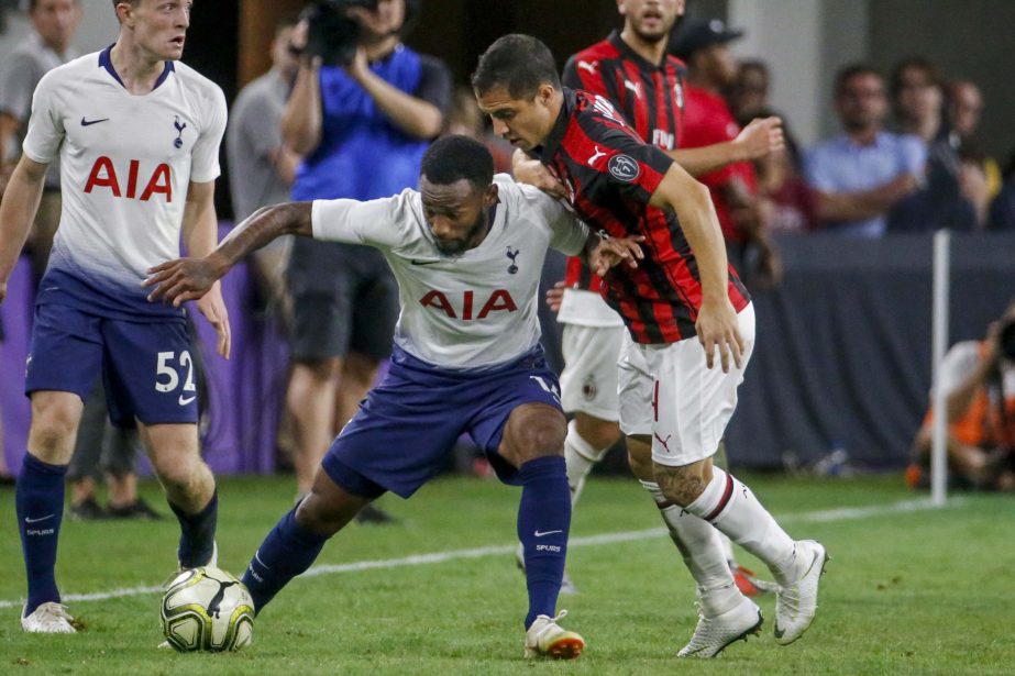 Tottenham midfielder Georges-Kevin Nkoudou keeps the ball from AC Milan midfielder Jose Mauri (right) during an International Champions Cup soccer match on Tuesday in Minneapolis.