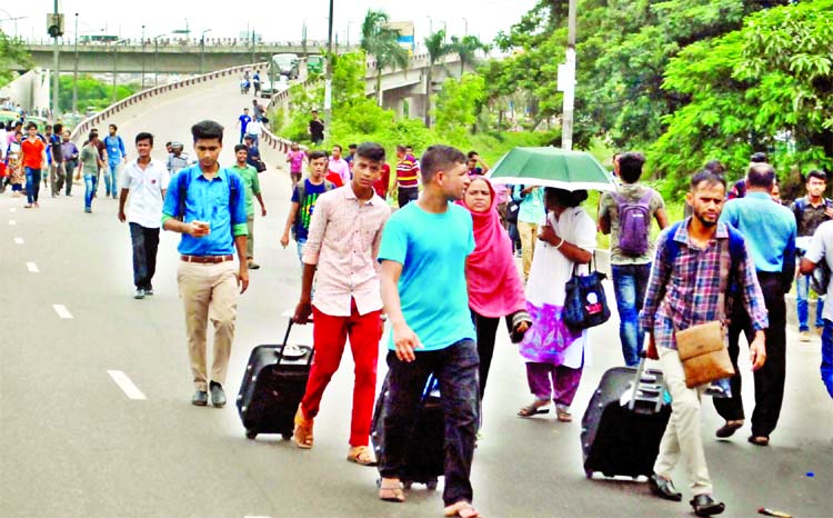 In absence of public transports in city, the people are seen going to their respective destinations on foot during the students agitation on Wednesday. This snap was taken from near the city's Airport Road area.