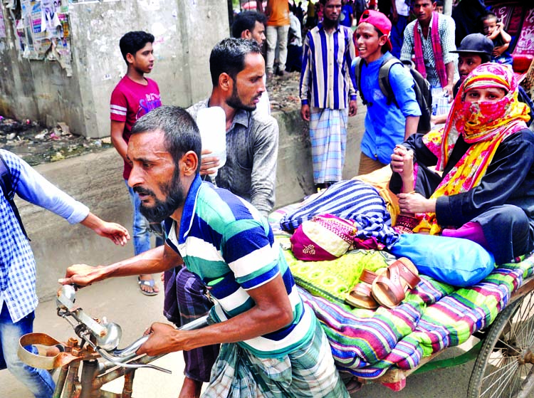 Due to students protest programme across the city, a patient being taken to hospital through a van on Wednesday. This picture was taken from city's Sayedabad area.