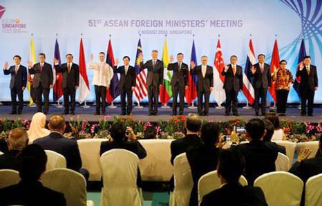 Singapore's Prime Minister Lee Hsien Loong and ASEAN foreign ministers pose for a group photo during the opening ceremony of the 51st ASEAN Foreign Ministers' Meeting in Singapore on Thursday.