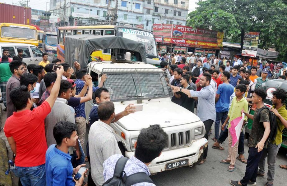 Students observing demonstration at the Port City as a part of countrywide programme demanding safe road yesterday.