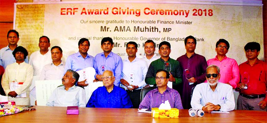 Finance Minister AMA Muhith at a prize giving ceremony at Economic Reporters Forum (ERF) on Wednesday among best economic and business reporters for 2018 organized by the Forum at its office in the city. He is flanked by ERF President Saiful Islam Dilal a