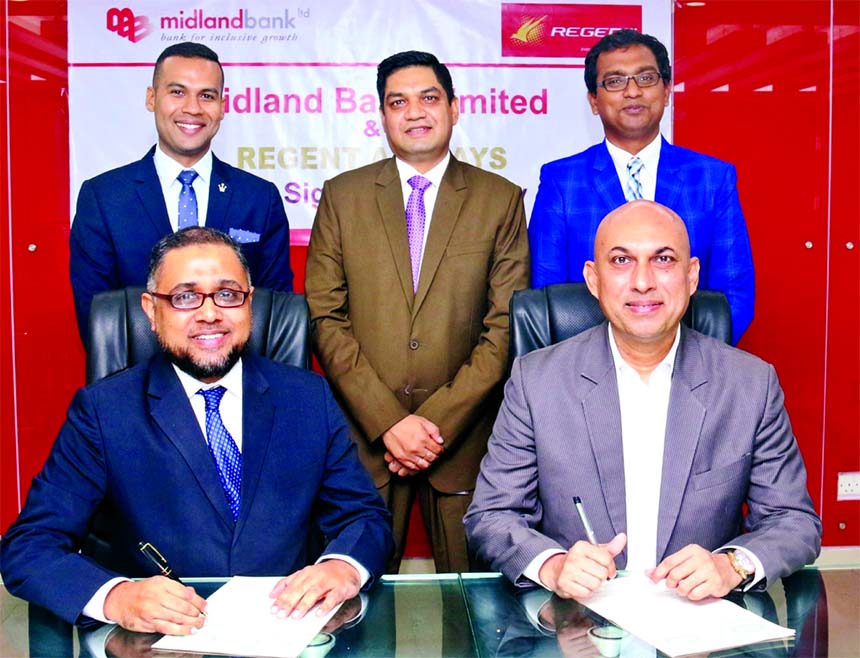 Md. Ridwanul Hoque, Head of Retail Distributions of Midland Bank Limited and Sohail Majid, Director (Marketing & Sales) of Regent Airways, signing an agreement at the Bank's head office in the city on Wednesday. Under the deal, Visa Credit Cardholders of