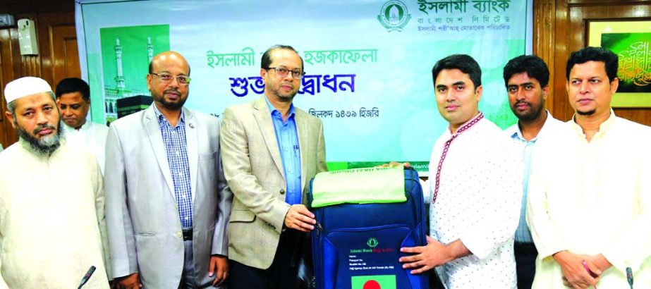 Mohammed Monirul Moula, Managing Director (CC) of Islami Bank Bangladesh Limited, inaugurates its 'Hajj Kafela 2018' for the intending Hajj Pilgrim officials of the bank at its head office in the city recently. Abu Reza Md. Yeahia, DMD and other senior