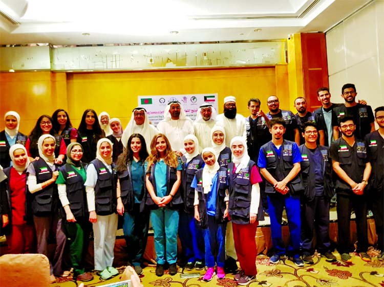 Ambassador of the State of Kuwait in Bangladesh Adel Mohammed A H Hayat along with some other guests and students of Kuwait Medical College poses for a photo session at a reception programme held at a city hotel for completing four-day long medical treatm