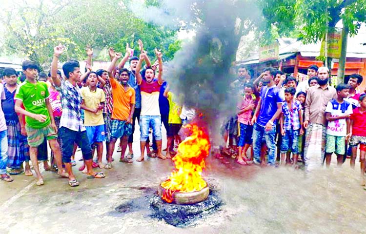 Locals including students set tyre on fire protesting against killing school girl Sadia Jahan as truck hit her at Sagordighi area in Sakhipur of Tangail on Friday.